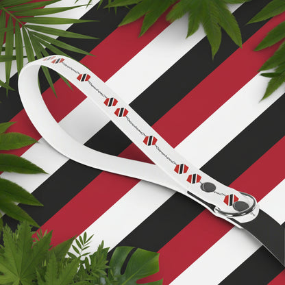 White dog leash with red and black pattern on a white background