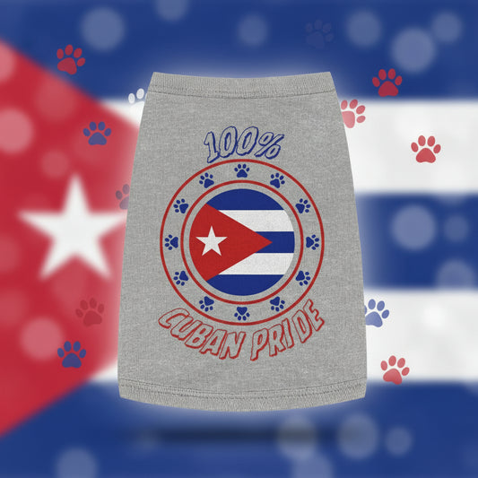 A dog wearing a gray tank top with '100% Cuban Pride' printed on the front.