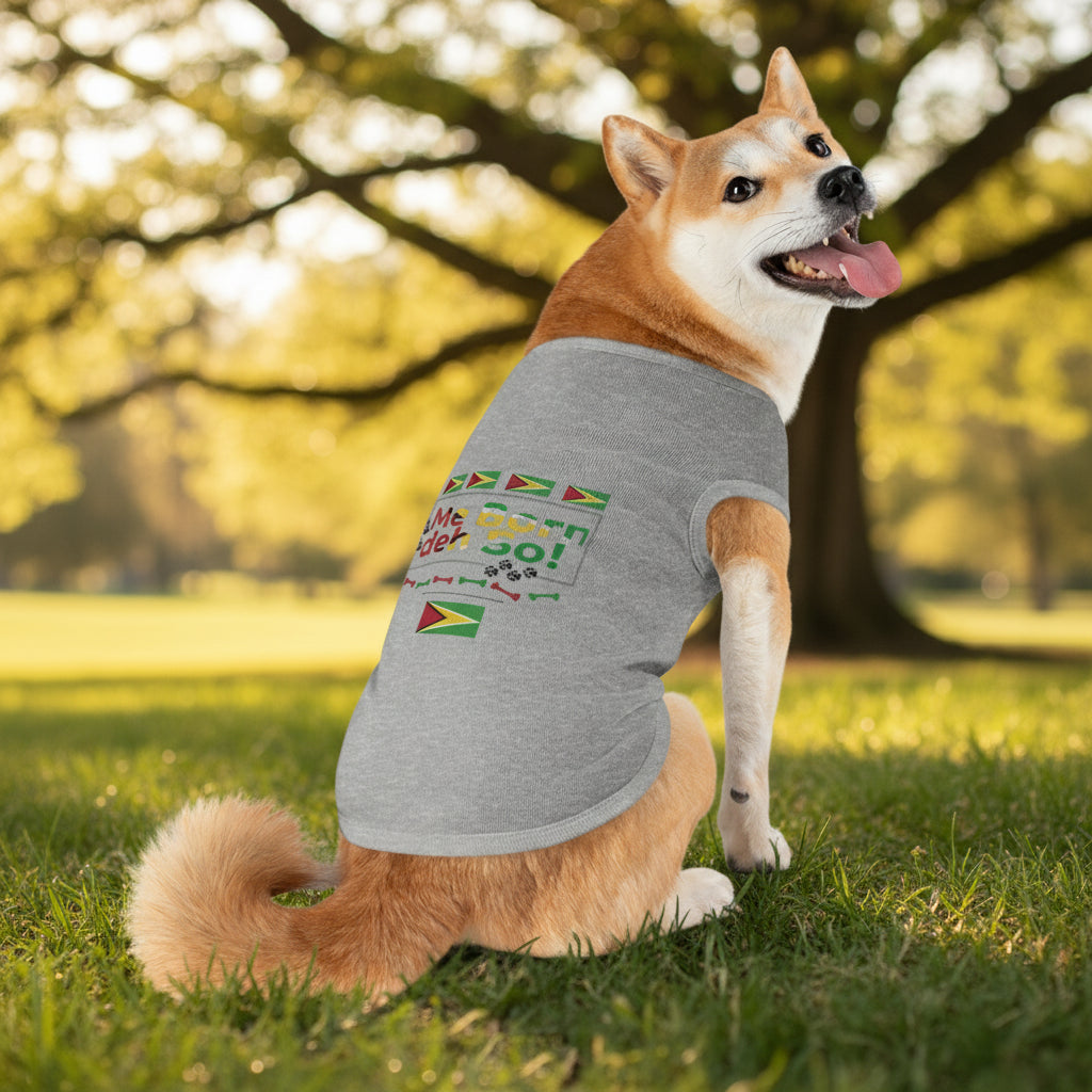 Dog wearing a gray sleeveless shirt with colorful text and flags on a white background