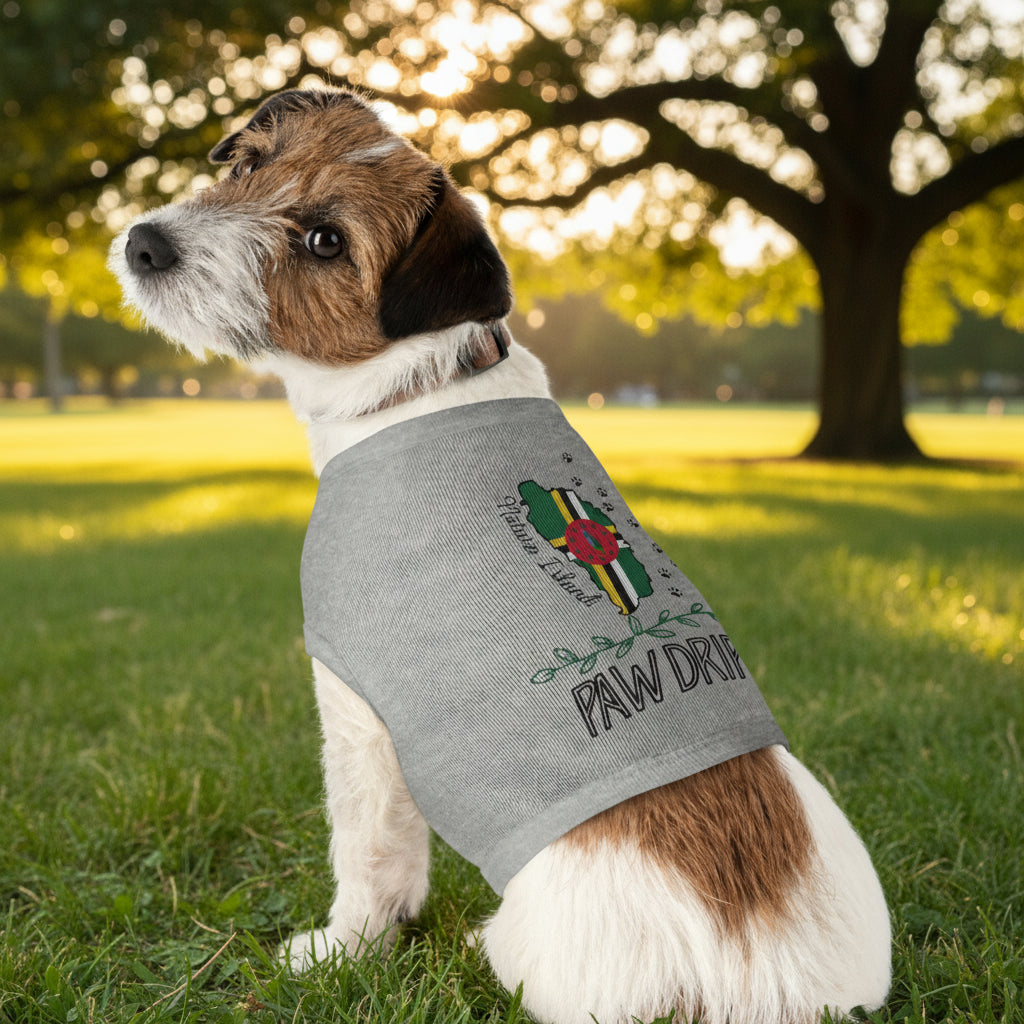 Dog wearing a gray shirt with a logo and text in a park