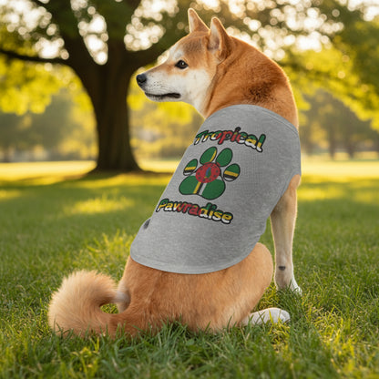 Dog wearing a gray tank top with 'Tropical Pawadise' text and paw print design on a white background