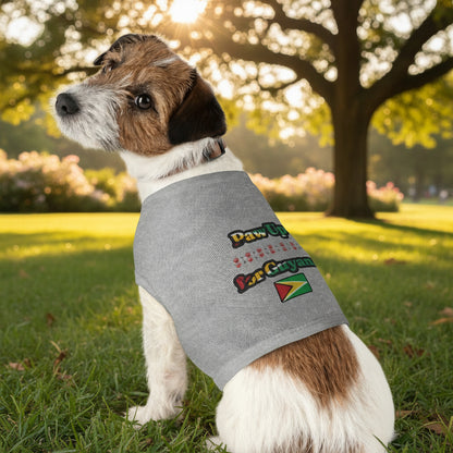 Dog wearing a gray sleeveless shirt with colorful text and a flag design on a white background