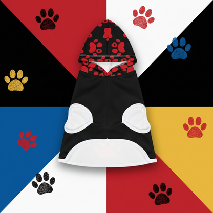 Black and red pet hoodie with paw print design on sand