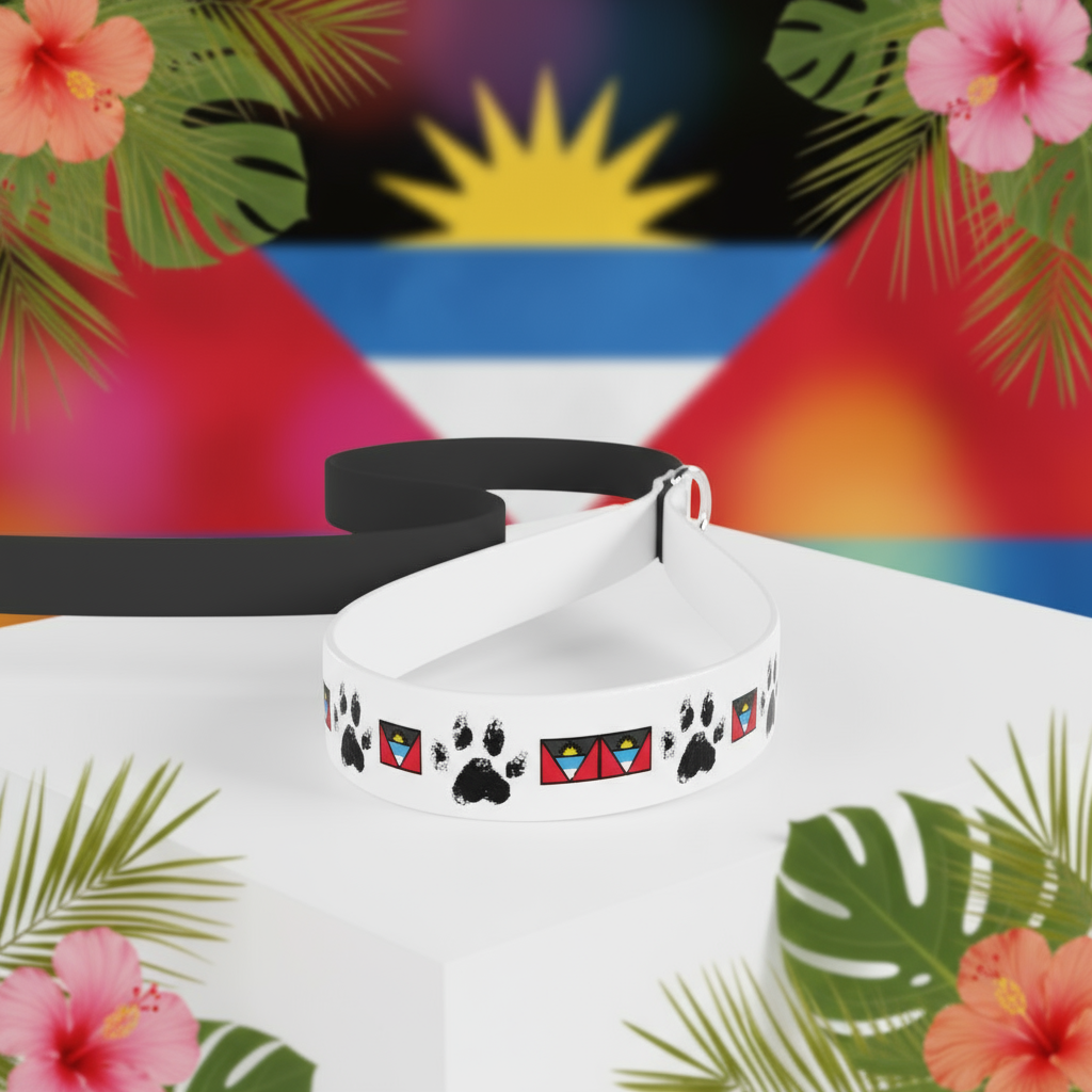 White dog collar with black paw prints and colorful triangle designs on a wooden surface with a blurred natural background.